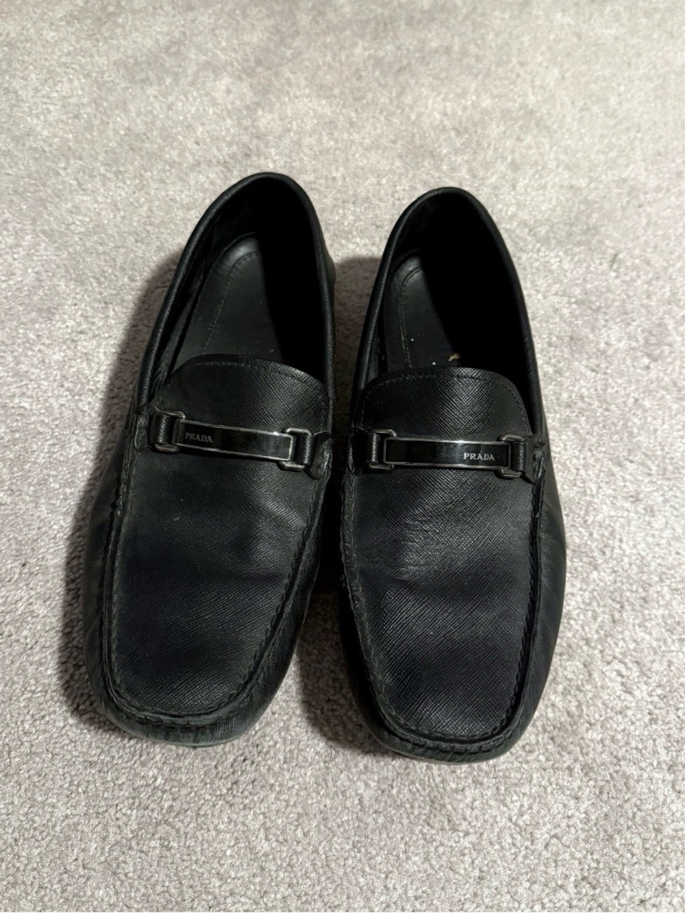 Prada Black Saffiano Leather Slip-On Loafers with Metal Bit